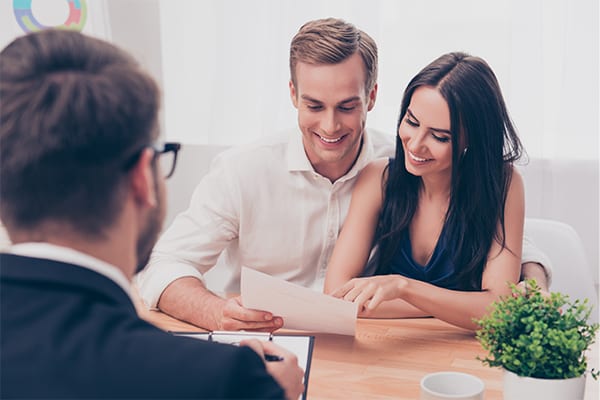 A couple looking at a document together