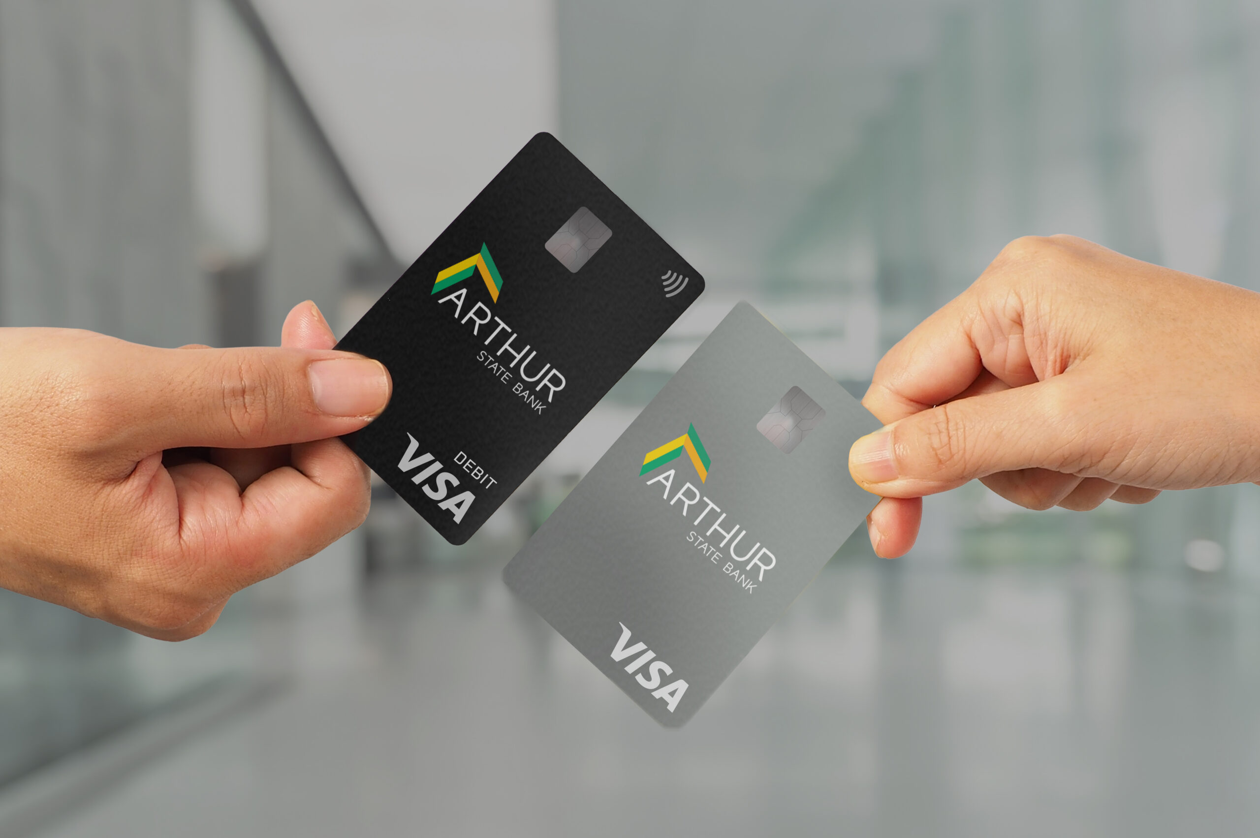 Two hands holding credit cards