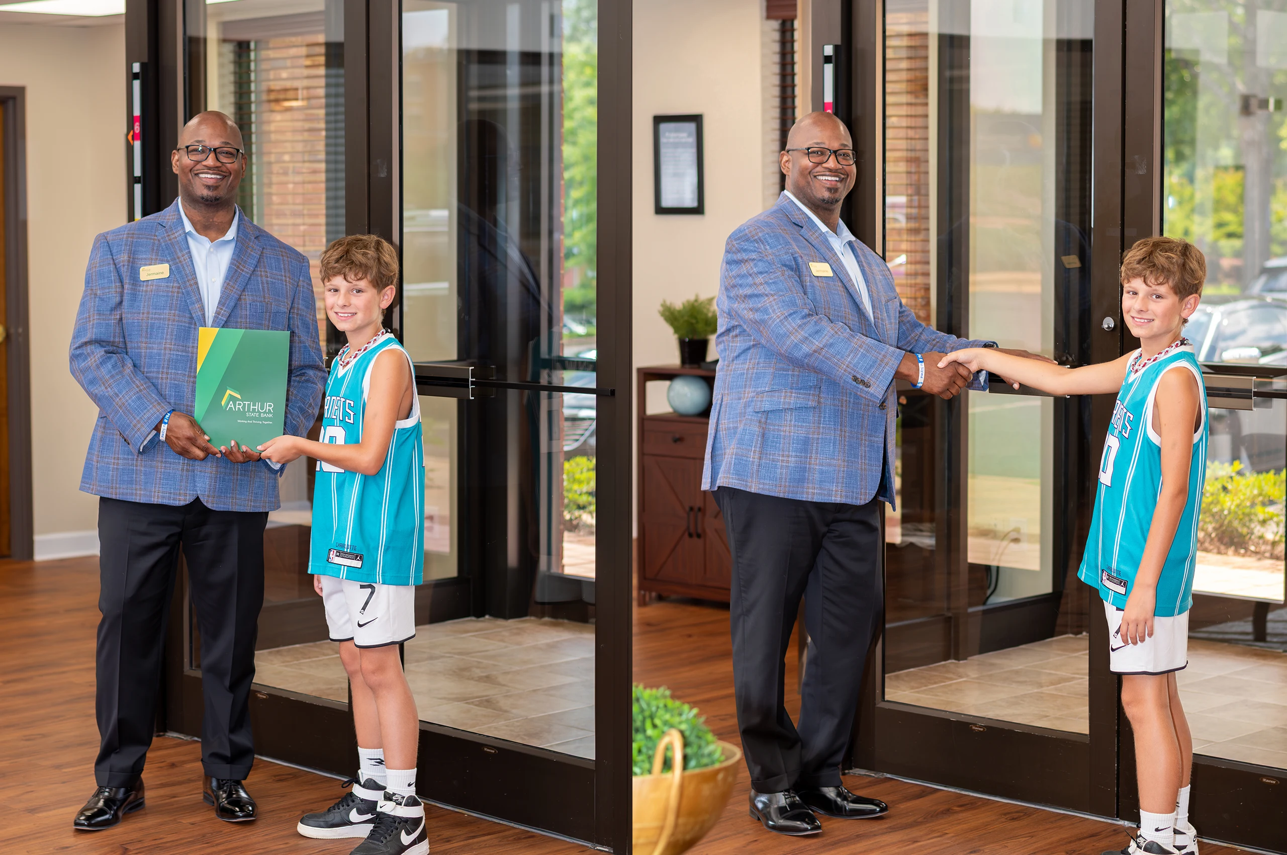 Arthur state bank employee shaking hands with and presenting a folder to a pre-teen boy